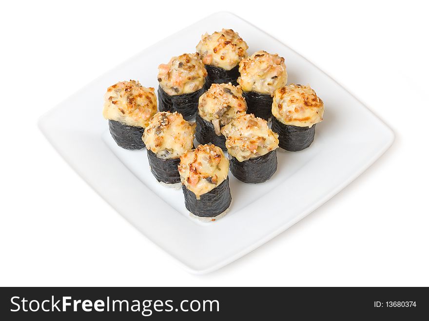 Baked sushi with salmon and mushrooms, cheese, sauce and sezam, nori, wasabi and rice.