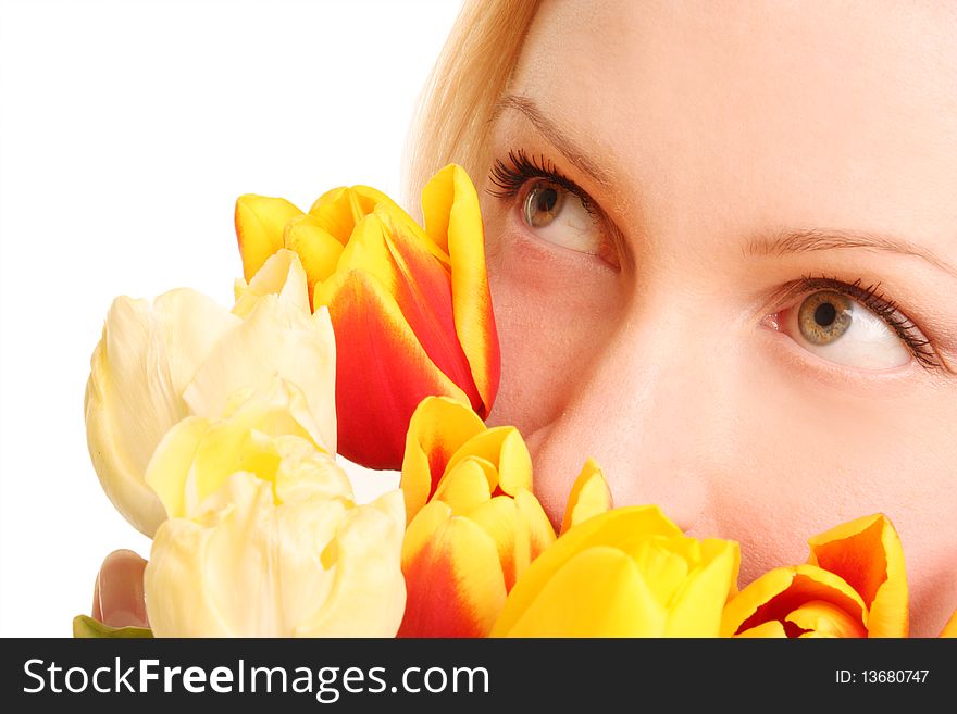 The beautiful woman with bouquet of yellow tulips. The beautiful woman with bouquet of yellow tulips