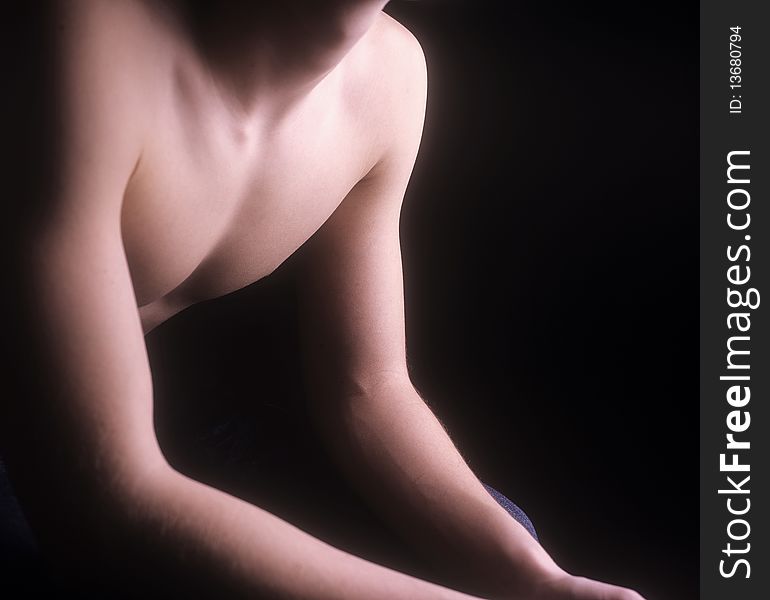 A studio shot of a body part of a young teen