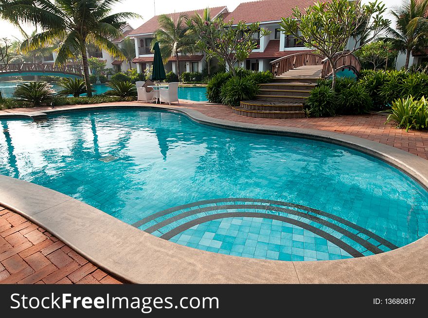 A beautiful large swimming pool at a local resort