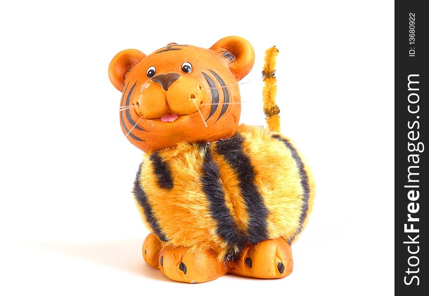 Ceramic tiger with fur trim. isolation. Ceramic tiger with fur trim. isolation