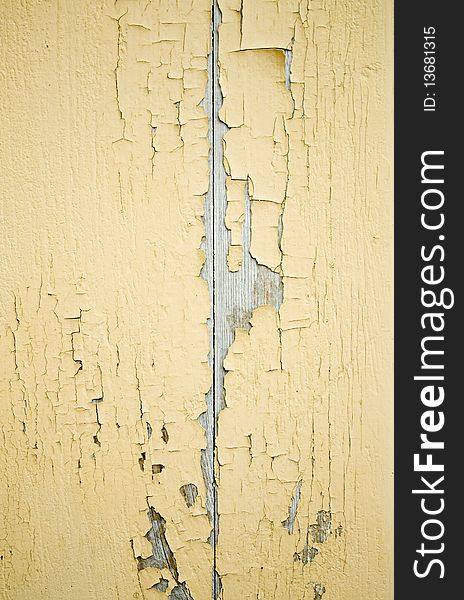 Cracked yellow ragged wall background texture