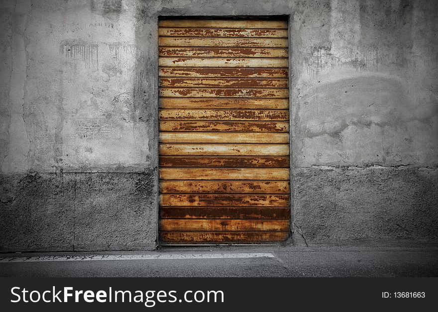 Old rusty entrance door of a shop