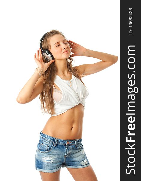 The young beautiful girl with headphones isolated on a white background