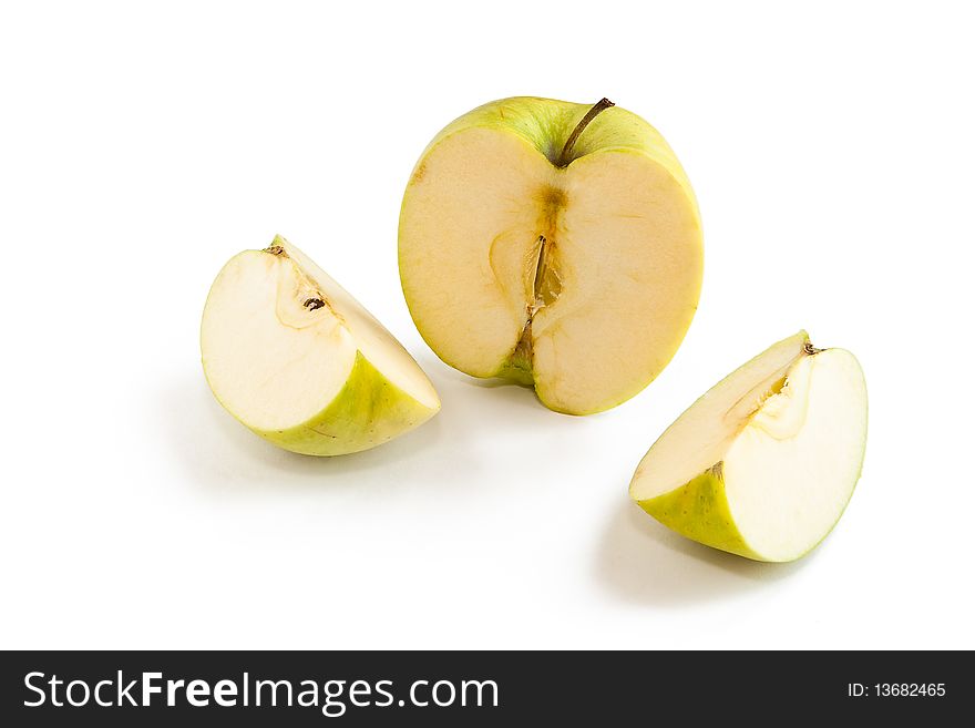 Green apple cut on three parts on white background. Green apple cut on three parts on white background