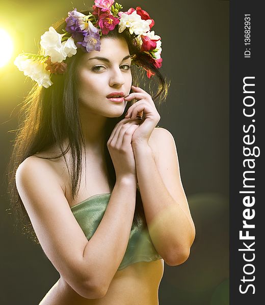 Studio portrait of a beautiful with flower crown. Studio portrait of a beautiful with flower crown