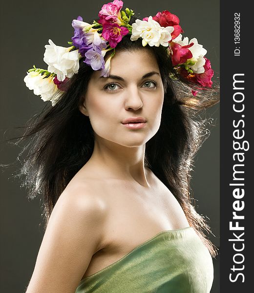 Studio portrait of a beautiful with flower crown. Studio portrait of a beautiful with flower crown