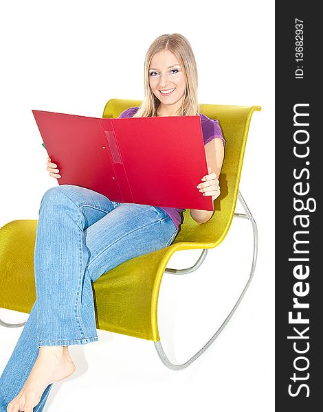 Caucasian woman sitting on green chair with open file. Caucasian woman sitting on green chair with open file