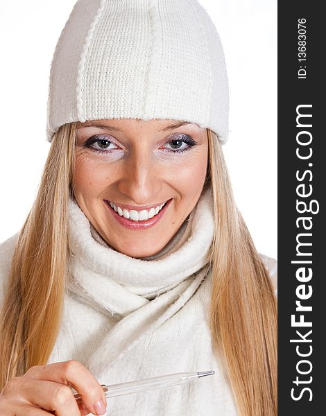 Caucasian blonde woman holding thermometer with white hat and scarf. Caucasian blonde woman holding thermometer with white hat and scarf