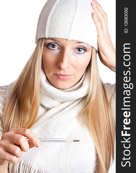 Caucasian blonde woman holding thermometer with white hat and scarf. Caucasian blonde woman holding thermometer with white hat and scarf