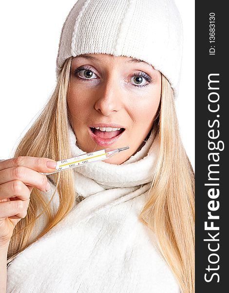 Caucasian blonde woman holding thermometer with white hat and scarf. Caucasian blonde woman holding thermometer with white hat and scarf