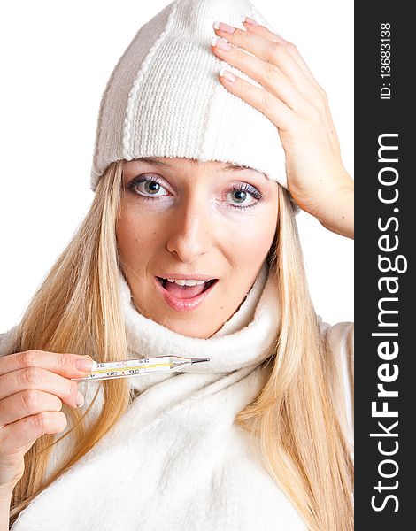 Caucasian blonde woman holding thermometer with white hat and scarf. Caucasian blonde woman holding thermometer with white hat and scarf