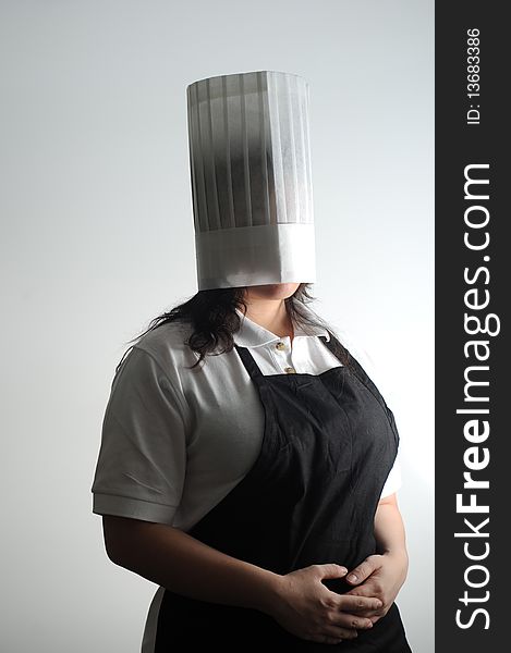 Chef wearing her hat over her head to deal with her cooking frustrations. Chef wearing her hat over her head to deal with her cooking frustrations