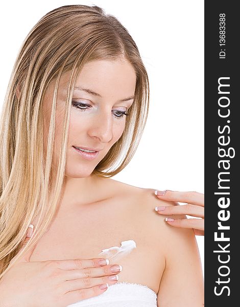 Caucasian blonde woman creaming chest