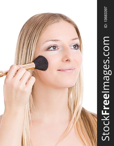 Woman makeup her face with brush