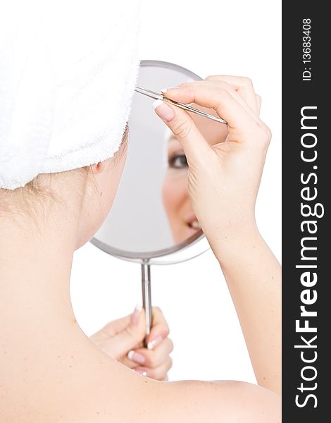 Woman makeup in mirror reflection on isolated background