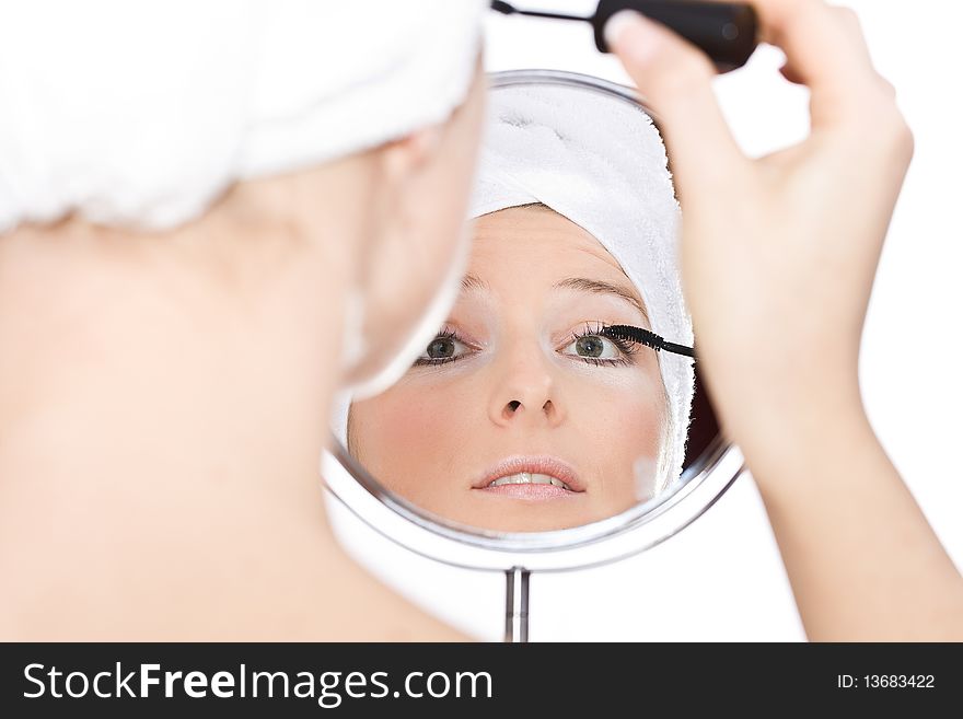 Woman makeup in mirror