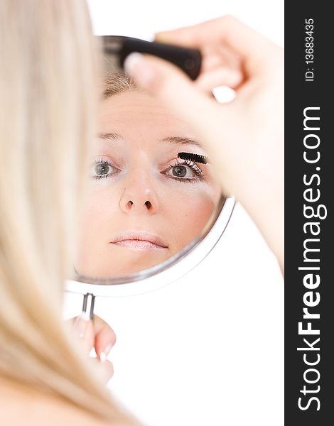 Woman makeup in mirror reflection on isolated background