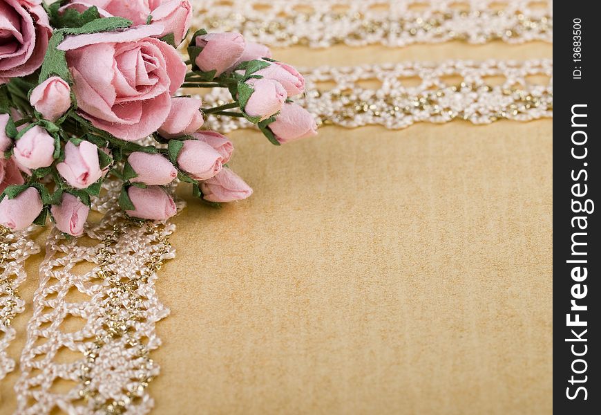 Closeup shot of pink paper flowers on beige background