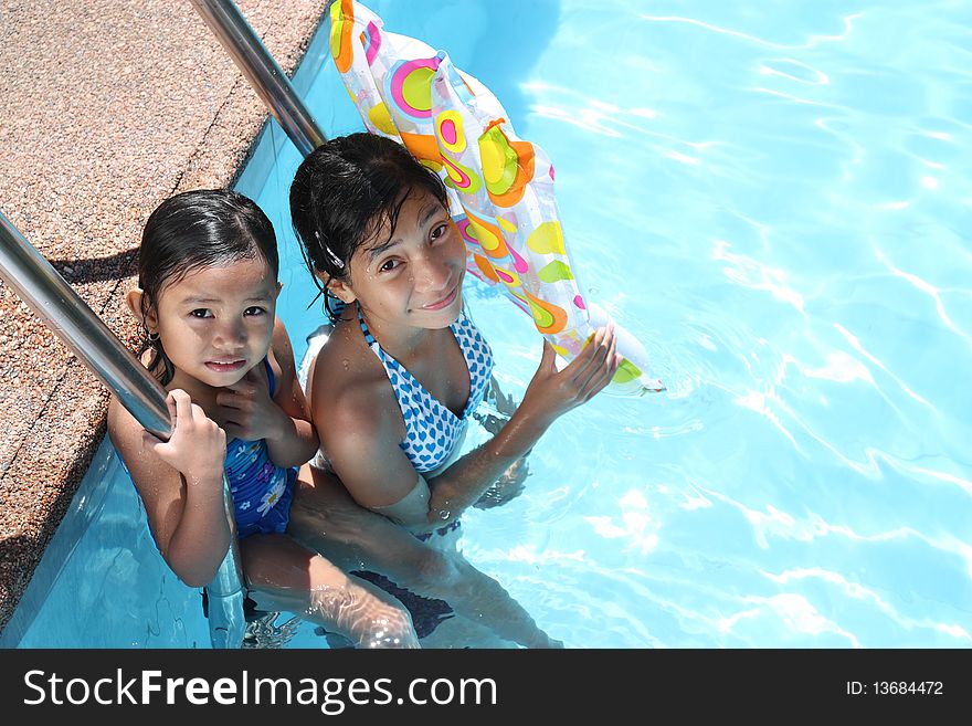 Portrait of young friends at the swimming pool