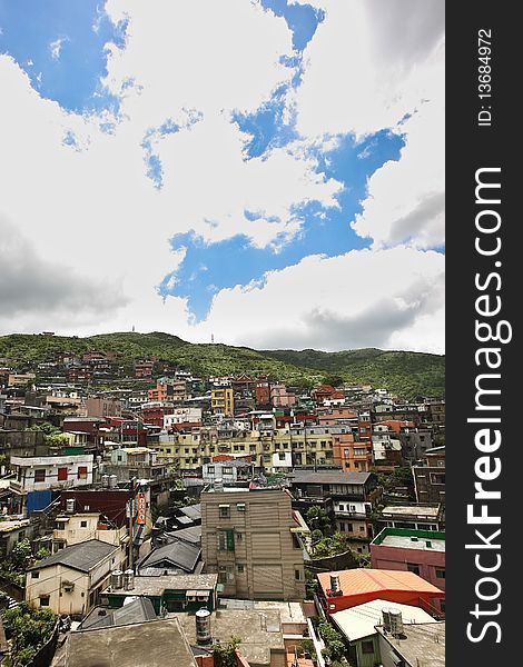 A beautiful bright sky with clouds over a dense suburban area in Taiwan. A beautiful bright sky with clouds over a dense suburban area in Taiwan.