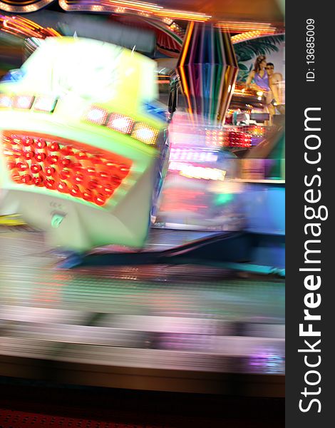 Blurred moving joy ride at carnival