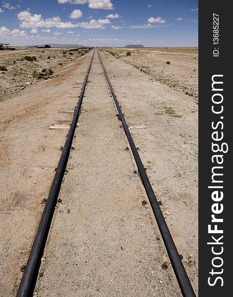 Abandoned old rail tracks leading to nowhere in Bolivian desert near Uyuni. Abandoned old rail tracks leading to nowhere in Bolivian desert near Uyuni