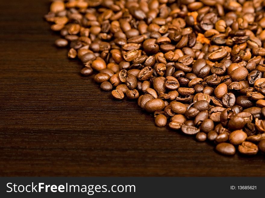 Background with coffee beans and ground coffe