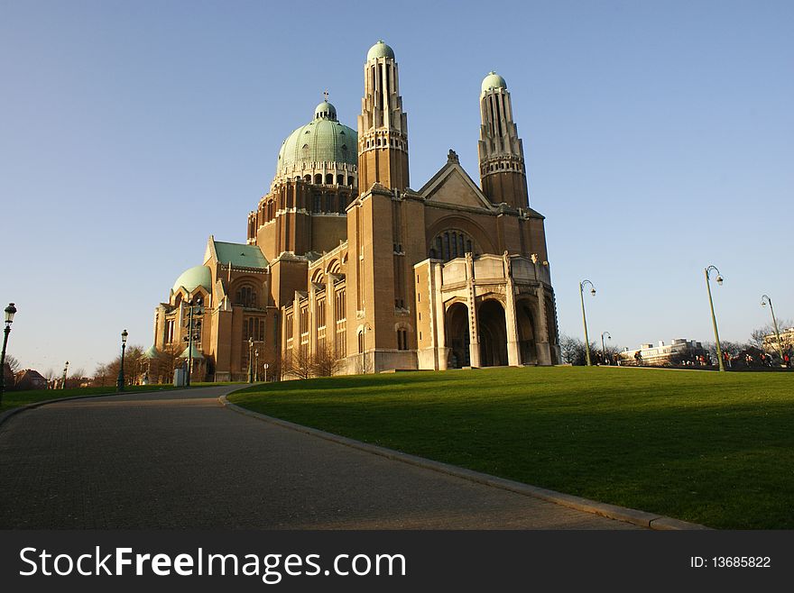 Cathedral in Brussel bulding blue sky tower top decorations colums architecture historic bulding