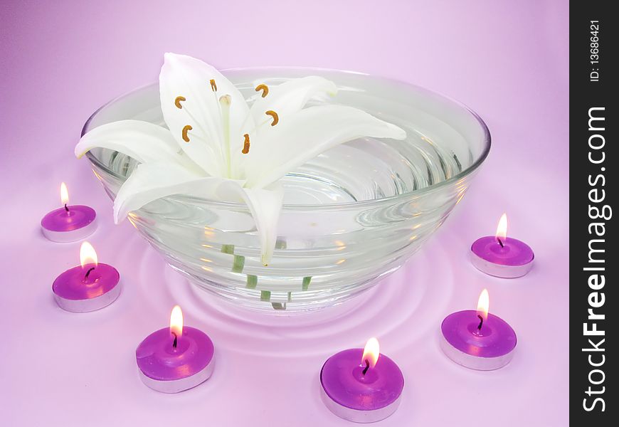 Spa lit lavender candles white ily flower health-care treatment. Spa lit lavender candles white ily flower health-care treatment