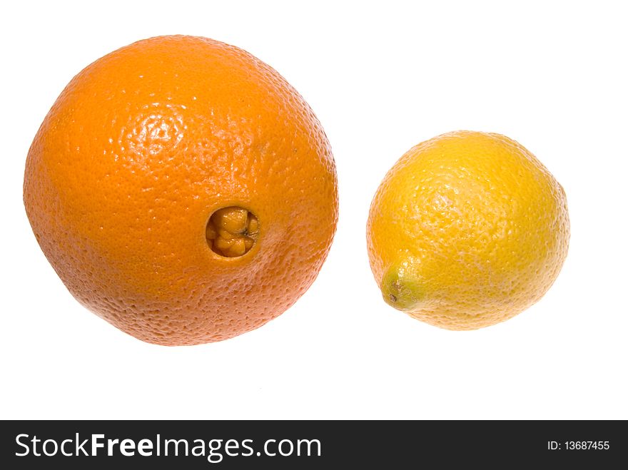 One orange and one lemon on an isolated background. One orange and one lemon on an isolated background.