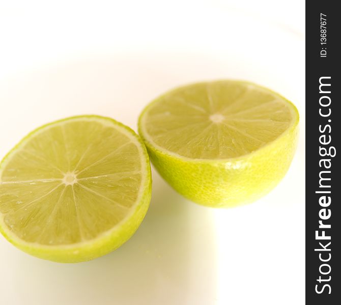 Fresh Limes on white background - close up