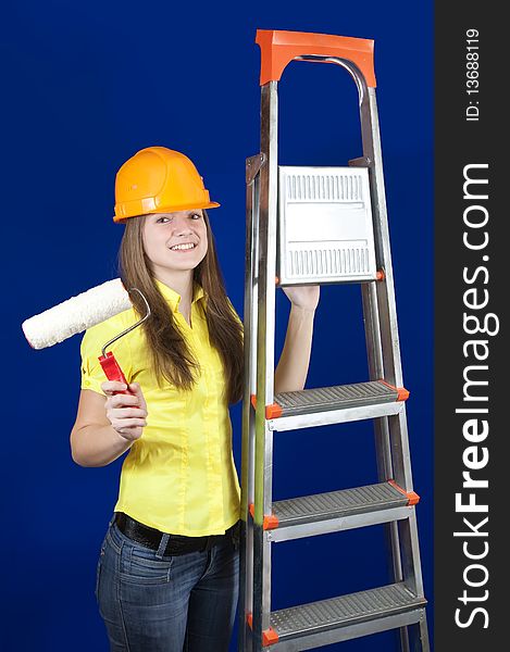Female house painters with paint rollers and scaling-ladder