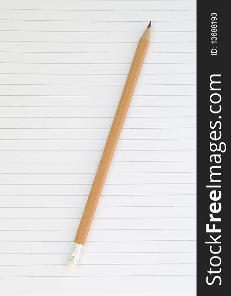 Pencil and notebook on white background