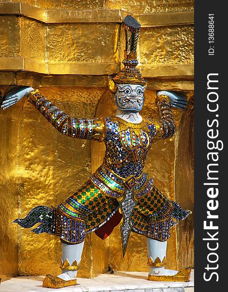 Giant statue at gold pagoda in Grand Palace Bangkok Thailand. Giant statue at gold pagoda in Grand Palace Bangkok Thailand.