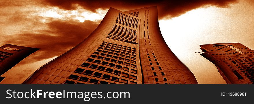 Abstract wide-angle shot of fat building with cloudy sky. Abstract wide-angle shot of fat building with cloudy sky