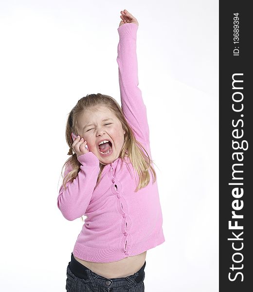 Little girl having fun with a mobile phone. Little girl having fun with a mobile phone