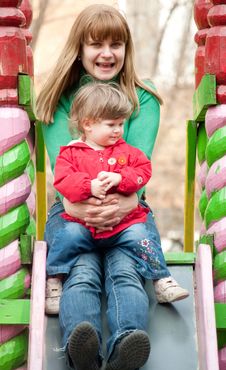 Mother And Daughter Sitting At The Top Of A Slide Royalty Free Stock Images Mother And Daughter Sitting At The Top Of A Slide Royalty Free Stock Images