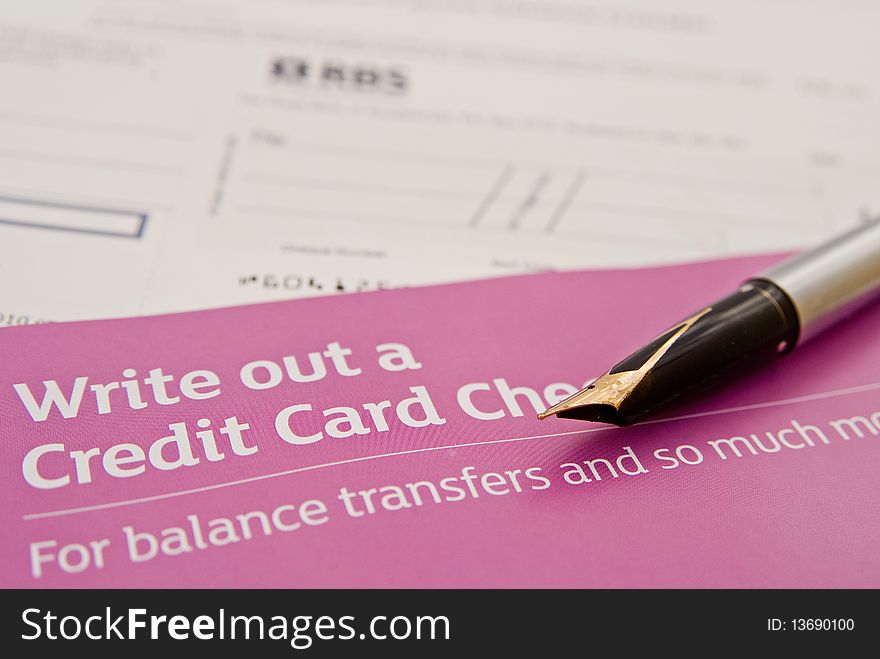 Write out a credit card check or cheque.