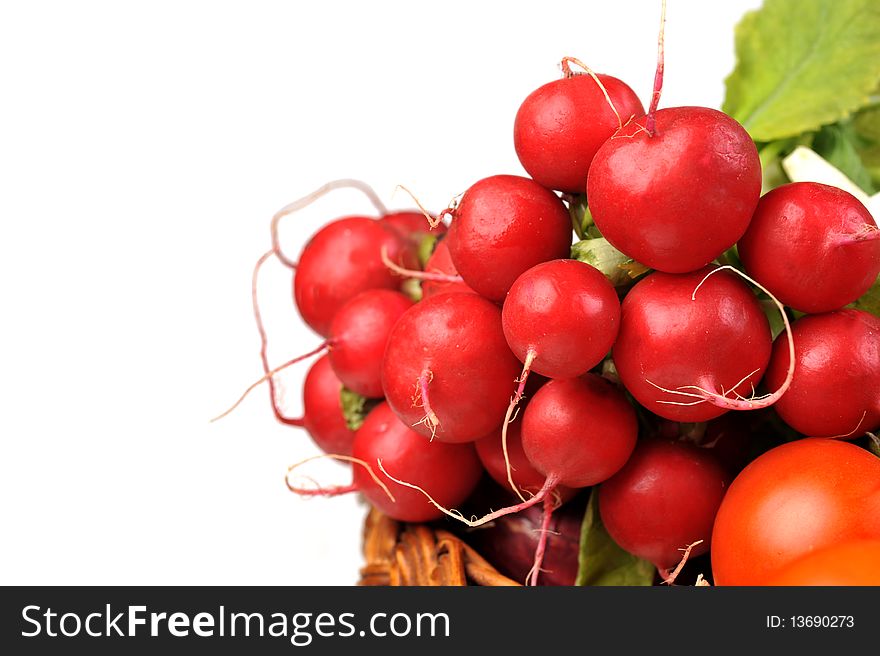 Full basket of red  radish and tomato