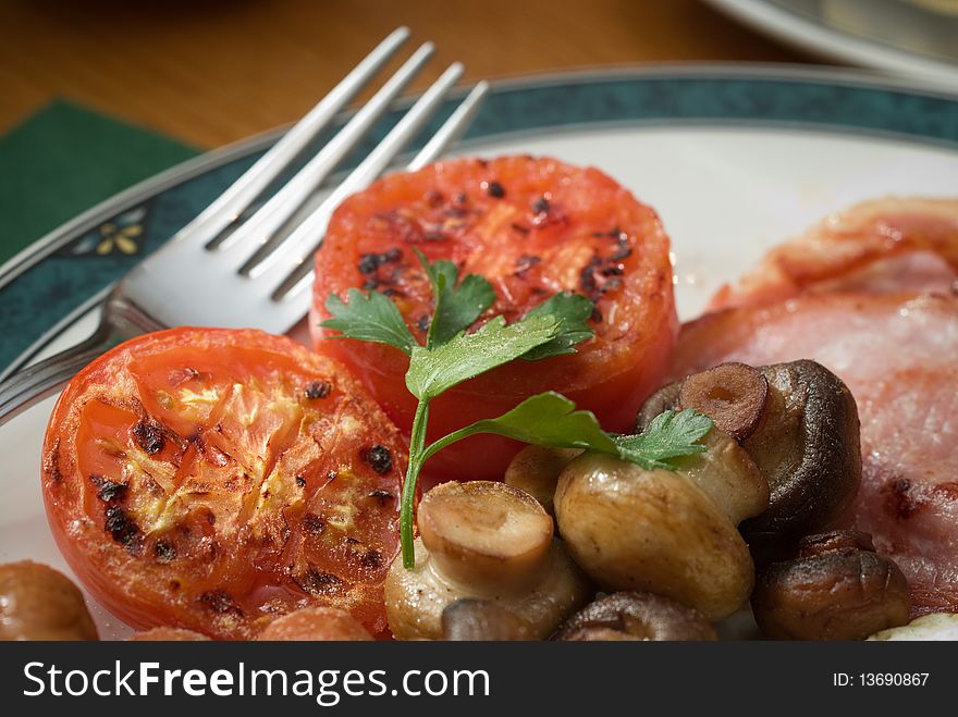 Grilled tomatoes as part of a traditional English Breakfast. Grilled tomatoes as part of a traditional English Breakfast.