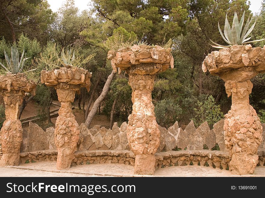 Stone columns with plants in park Guell, Barcelona. Stone columns with plants in park Guell, Barcelona