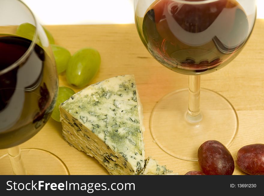 French eating delights with wine and cheese, on white background. French eating delights with wine and cheese, on white background
