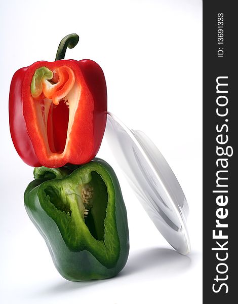 Red and green bell pepper on white. Red and green bell pepper on white