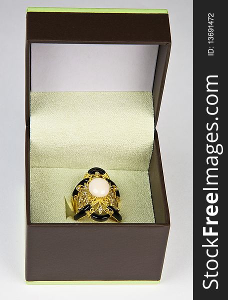 Coral statement ring with carved black onyx and diamonds in presentation box box