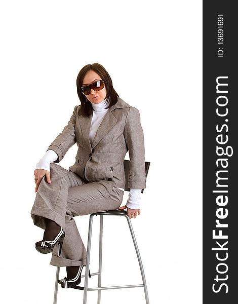 Photo of elegant businesswoman in businessdress and sunglasses with timer. Photo of elegant businesswoman in businessdress and sunglasses with timer