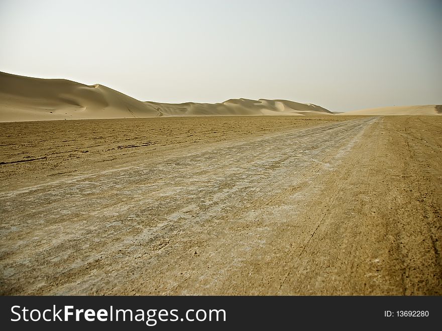 A well worn path, created by SUVs and ATVs in the deserts of Qatar. A well worn path, created by SUVs and ATVs in the deserts of Qatar.