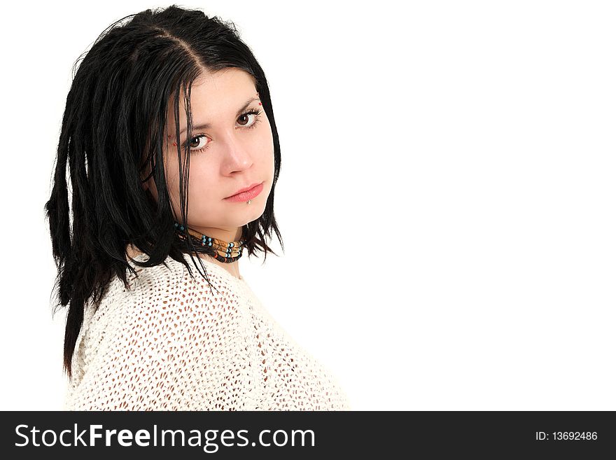 Portrait of young teenage girl with braided hair and face piercings, studio shot