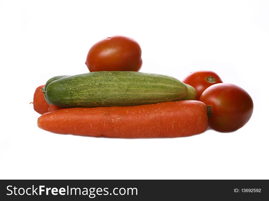 Tomatoes, cucumbers, and carrots for cooking vegetarian dishes. Tomatoes, cucumbers, and carrots for cooking vegetarian dishes.