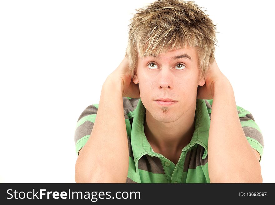 Portrait of young man looking up, studio shot